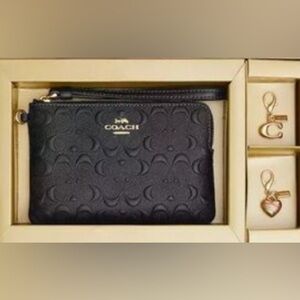 Brand new coach wallet in original box with charms